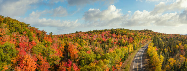 Sunset Autumn drive through the tunnel of Trees in Michigan Upper Peninsula UP - Highway 41  M26...