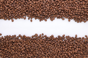 Freshly roasted coffee beans background top view isolated on white background with top copy space using for your advertising