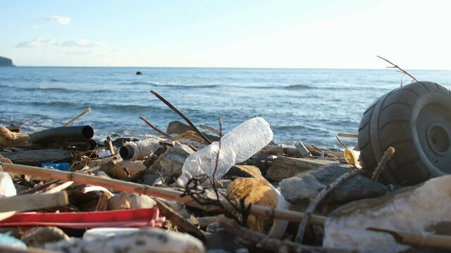 Discarded plastic trash pollution on contaminated ocean sea coast ecosystem,environmental waste 