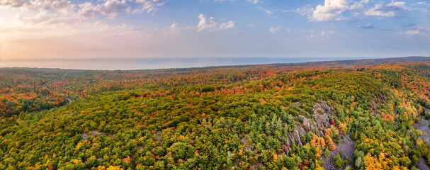 Autumn aerial views on the drive through the tunnel of Trees in Michigan Upper Peninsula UP - Highway 41  M26 Aerial view