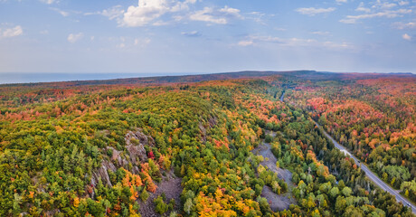 Autumn aerial views on the drive through the tunnel of Trees in Michigan Upper Peninsula UP - Highway 41  M26 Aerial view