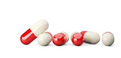 Red and white pill capsules over white background, medical treatment, pharmaceutical or medication concept