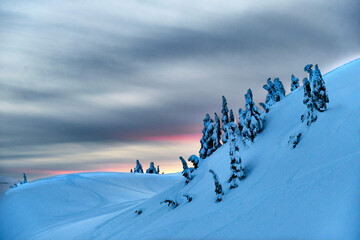 Winter sunset in mountains. Mount Seymour. North Vancouver. British Columbia. Canada 