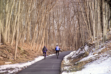  People riding bike in park on sunny day, healthy lifestyle