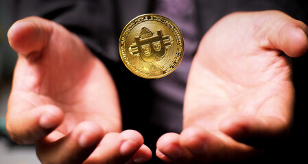 Digital coin Floating over the palm against a blurred background