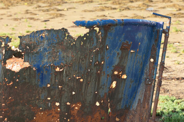 Blue rusty ship on beach bembridge isle of wight close up