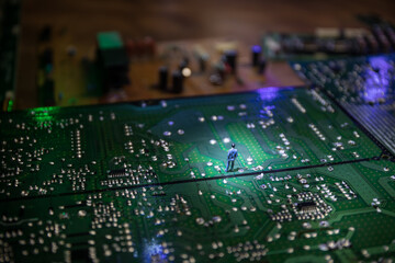 Stylized photo of an electronic microcircuit. Microcircuit, contacts, electronics, motherboard. Black background. Macro photography of electronic devices.