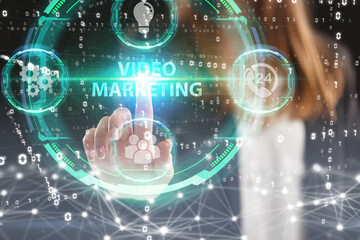 Business, Technology, Internet and network concept. Young businessman working on a virtual screen of the future and sees the inscription: Video marketing