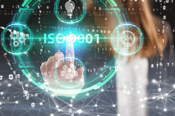 Business, Technology, Internet and network concept. Young businessman working on a virtual screen of the future and sees the inscription: ISO 9001