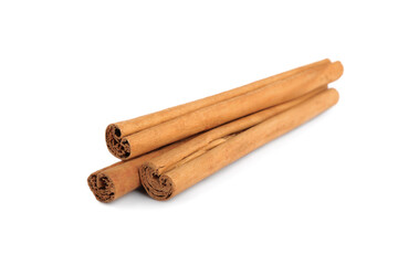 Aromatic dry cinnamon sticks on white background