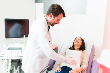 Expectant mother smiling in her routine checkup for her pregnancy