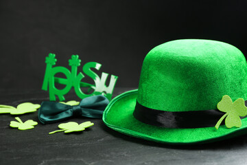 Leprechaun's hat and St. Patrick's day decor on black table