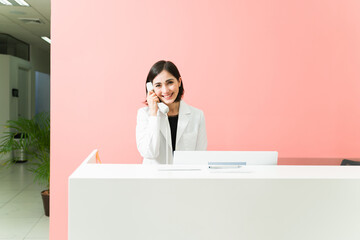Portrait of a female worker talking on the phone about medical services