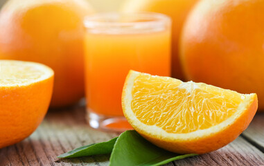 Healthy fruits and orange slice, Fresh orange juice in the glass with orange fruit on wooden background