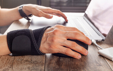 Chronic trauma to the wrist joint  in people using computer mouse may lead to disorders that cause...