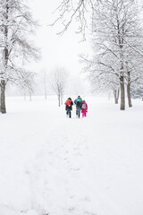 Fototapeta na wymiar Kids walking in the snow