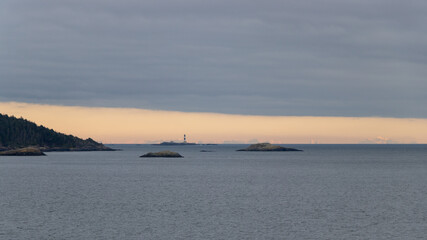 Horizon view over the ocean of snow capped mountains on a cloudy evening