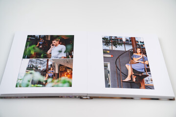 pages of photobook from photo shoots of a beautiful happy couple in retro house.
