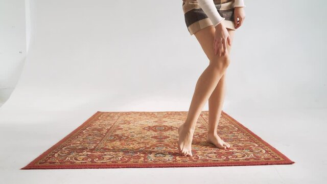 A Woman, A Girl Walking On A Beautiful Carpet Barefoot. Healthy Legs Without Varicose Veins