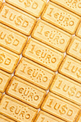 Pastry with the EUR and USD currency symbols located diagonally, selective focus, background