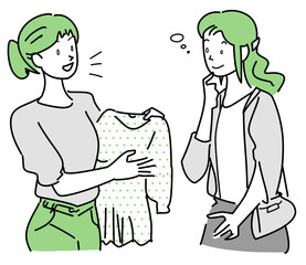 衣料品店で接客仕事に従事している女性店員と女性客