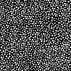 Seamless hand drawn dots pattern. White dots on black background. Abstract pattern for fabric, wrapping, wallpapers.