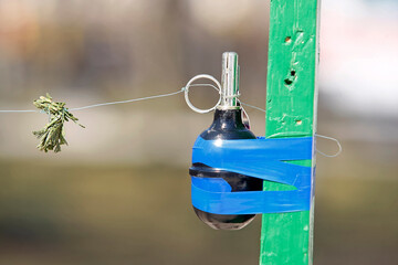 disguised grenade on a stretched line, trap