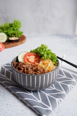 beef teriyaki rice bowl with vegetables in a white background