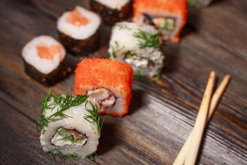 with sushi chopsticks ginger delicacy wooden background meal