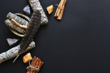 A top view image of a healing smudge kit on a black background.