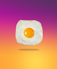 Funny fried eggs on a yellow-pink gradient background. The concept of a good day and mood