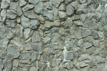 A grey stone wall texture background abstract.closeup shot

