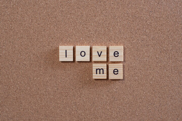 love me wooden letters on cork board