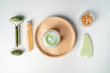 Organic Facial cosmetics. Spa treatments. Jade roller for facial massage. essence for skin health. gouache scraper, face cream, ampoules for wrinkles on the eyelids.