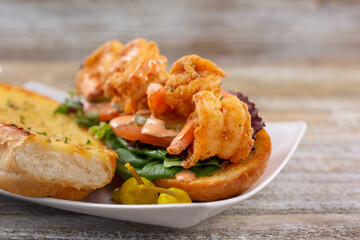 A view of a shrimp po boy sandwich.