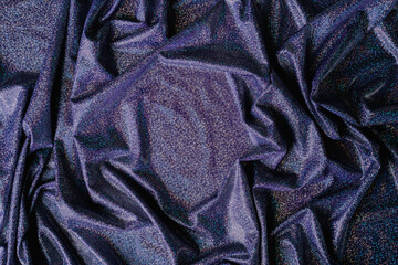 Purple holographic fabric. Beautiful folds in the fabric. Background for your subject