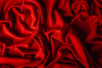 Fototapeta premium Red fabric with nice folds. Background for your product. Luxury draperies