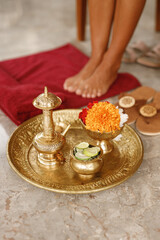 Spa procedure concept on salonon Bali island. Wash legs ritual before massage