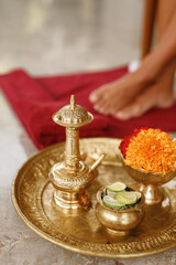 Spa procedure concept on salonon Bali island. Wash legs ritual before massage