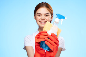 cheerful woman washing supplies housework lifestyle blue background