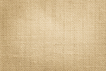 Jute hessian sackcloth canvas woven texture pattern background in light beige cream brown color blank empty