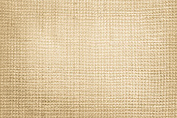 Fototapeta na wymiar Jute hessian sackcloth canvas woven texture pattern background in light beige cream brown color blank empty