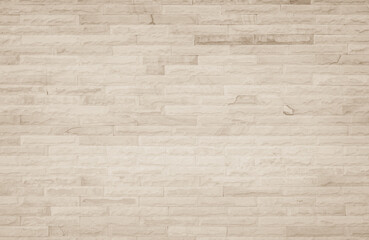 Empty background of wide cream brick wall texture. Beige old brown brick wall concrete or stone textured, wallpaper limestone abstract flooring/Grid uneven interior rock. Home decor design backdrop.