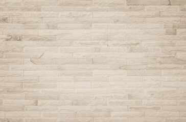 Empty background of wide cream brick wall texture. Beige old brown brick wall concrete or stone textured, wallpaper limestone abstract flooring/Grid uneven interior rock. Home decor design backdrop.