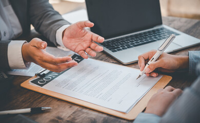 businessman is negotiating, advising, and explaining the matter of the contract to be agreed to sign the contract.