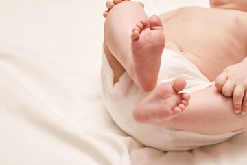 Little child feet. Toddler legs. Kid boxer panty. Baby person. Tiny health care. White children underware. Massage concept. Male person