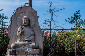 Seated Buddha carved in rock at Manbulsa Temple in Yeongcheon, South Korea.