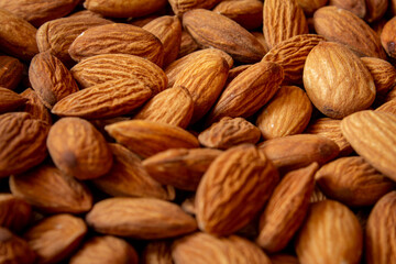Fototapeta premium Top view of almonds in a heap. Use for Healthy snack concept.