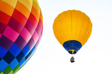 Multicolored air balloon in clear blue sky