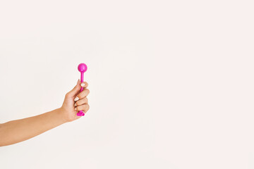 Young woman hand holding femine sex toys. Kegel adult exercise. Intimate gymnastics. Recovery...